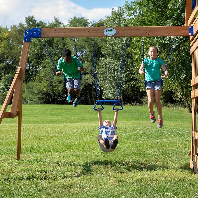 Backyard Discovery Beach Front Cedar Wood Swing Set with Wave Slide, Play Deck, Monkey Bars, Rock Wall Ladder, Shaded Picnic Area, Snack Bar, Belt Swings, Trapeze, Sandbox Area, Outdoor Playset